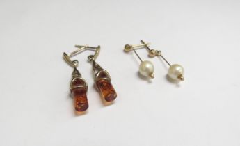 A pair of 9ct gold amber drop earrings and a pair of 9ct gold pearl drop earrings with a jade