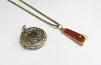 A gold pendant stamped 750 with cornelian panel, 5g hung on a 9ct gold chain 46cm long, 4.4g and a