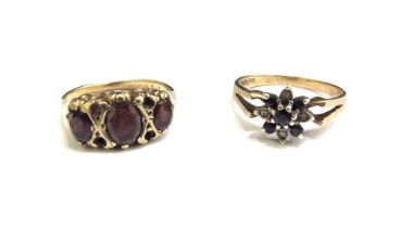 Two 9ct gold rings including sapphire and diamond chip and garnet, sizes O/P and L, 5.9g