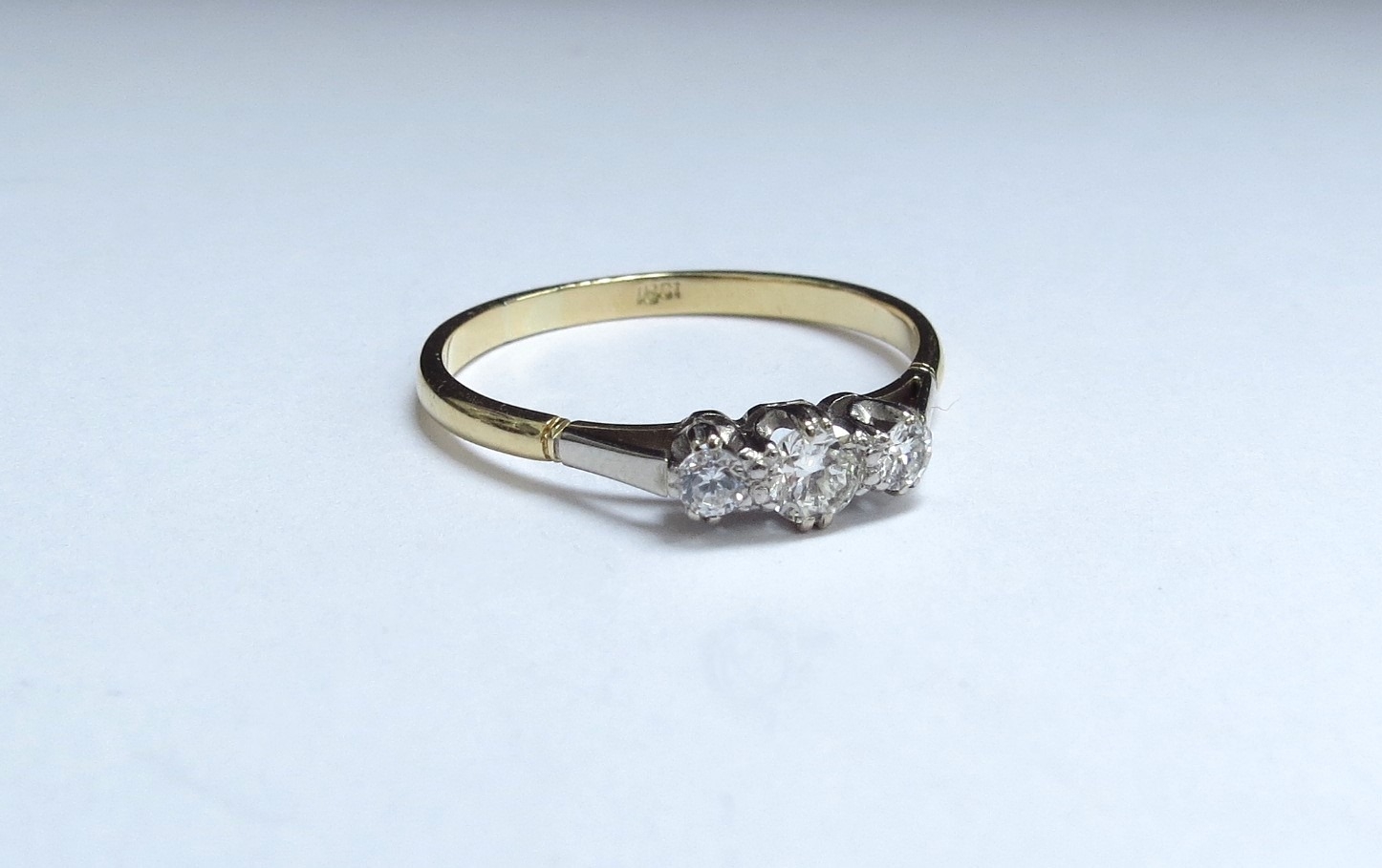 A three stone diamond ring, stamped 18ct. Size W/X, 2.6g - Image 3 of 5