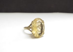 A 9ct gold ring with an oval citrine, 18mm x 12mm. Size N, 5g