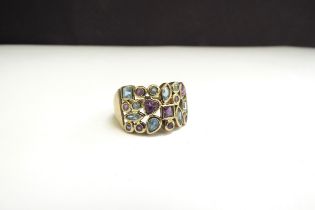 A 9ct gold amethyst and topaz ring. Size R, 5.4g