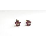 A pair of 9ct gold ruby and diamond floral stud earrings, 1.1g