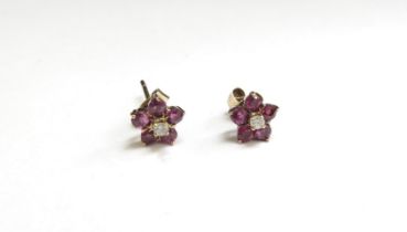 A pair of 9ct gold ruby and diamond floral stud earrings, 1.1g