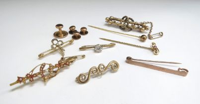 Five 9ct gold brooches including seed pearl bow, wishbone, scroll and stone set examples, three