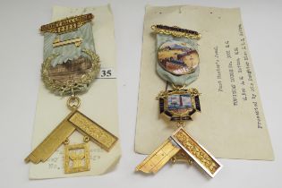 Two 15ct gold Masonic Medals one with enamelled decoration, with ribbons, 95.3g total