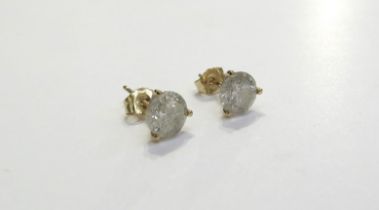 A pair of diamond stud earrings 1ct each approx in yellow gold three claw setting marked 14k, 1.2g