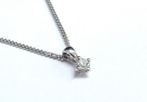 An 18ct white gold necklace, 40cm long hung with a diamond solitaire 0.15ct approx, 3.3g