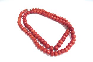 A red coral bead necklace, 66cm long, 71g