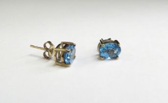 A pair of 9ct gold London blue topaz stud earrings, 1.7g