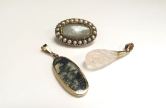 A moss agate pendant, Victorian memorial brooch and a quartz wrythen cut pendant (3)