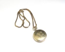 A 9ct gold box chain necklace, 44cm long, 9.5g hung with a circular photograph locket, unmarked, 4.