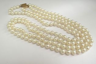 A double strand pearl necklace, can be worn as separate necklaces, 14k gold clasp, 62cm and 54cm