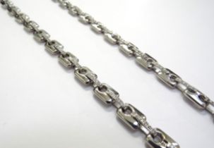 A white gold rectangular and diamond set bar link necklace, clasp marked "BREV SAURO 18k", 66cm