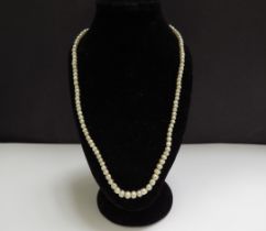 A single strand pearl necklace, 36cm long