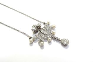 An early 20th Century diamond and pearl cluster pendant necklace with pear cut diamond droplet 0.