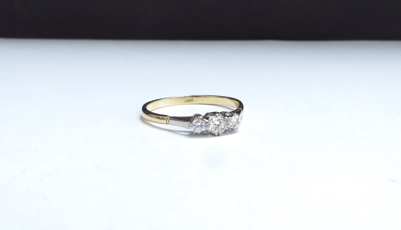 A three stone diamond ring, stamped 18ct. Size W/X, 2.6g - Image 5 of 5