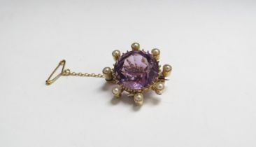 An amethyst and pearl brooch, unmarked