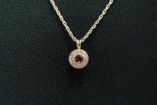 A ruby and diamond pendant hung on gold chain, stamped 9ct, 44cm long, 2.7g