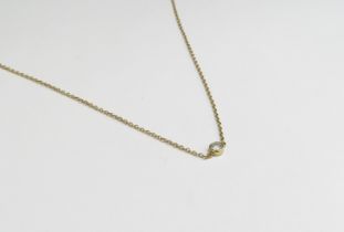 An unmarked necklace set centrally with a single diamond 0.10ct approx, 42cm long, 2g