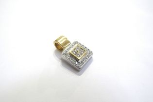 An 18ct two tone gold pendant of square form set centrally with four canted square cut diamonds in