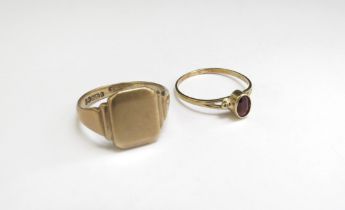 A 9ct gold signet ring, vacant shield. Size R, 4.5g and a gold ring stamped 585 with oval dark