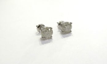 A pair of diamond stud earrings 1.15ct each approx in four claw white gold setting, stamped 14k, 1.