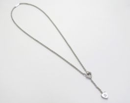 A Cartier 18k white gold heart Y shape swing drop single diamond necklace, marked NM2397750, 40cm