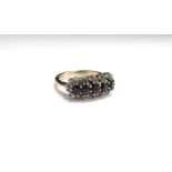A 9ct gold sapphire and diamond cluster ring. Size N/O, 3.3g