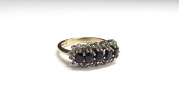 A 9ct gold sapphire and diamond cluster ring. Size N/O, 3.3g