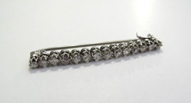 An Edwardian diamond bar brooch, fourteen old mine cut diamonds, 1.12ct total approx, in white