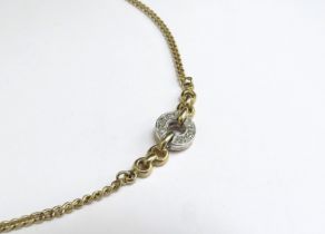 A gold necklace stamped 750 with a diamond halo on a frozen section, 44cm long, 9.1g