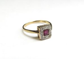An 18ct gold platinum set ruby and diamond ring in square setting. Size H, 1.5g