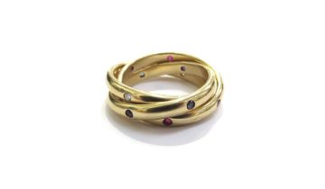 A Cartier gold trinity ring diamond, emerald and ruby set bands, marked Cartier 1995 750, 52