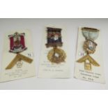 Three 9ct gold Masonic Medals with enamelled decoration and ribbons, 73.9g total