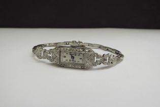 An Art Deco 18ct white gold diamond set cocktail watch, with sprung strap, 18.4g