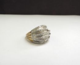 A multi-row baguette and round cut diamond ring, stamped 925. Size O, 6.1g