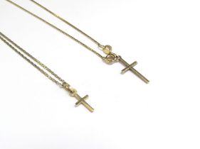 An 18ct gold chain hung with a 9ct gold cross pendant and a neckchain stamped 585 hung with gold