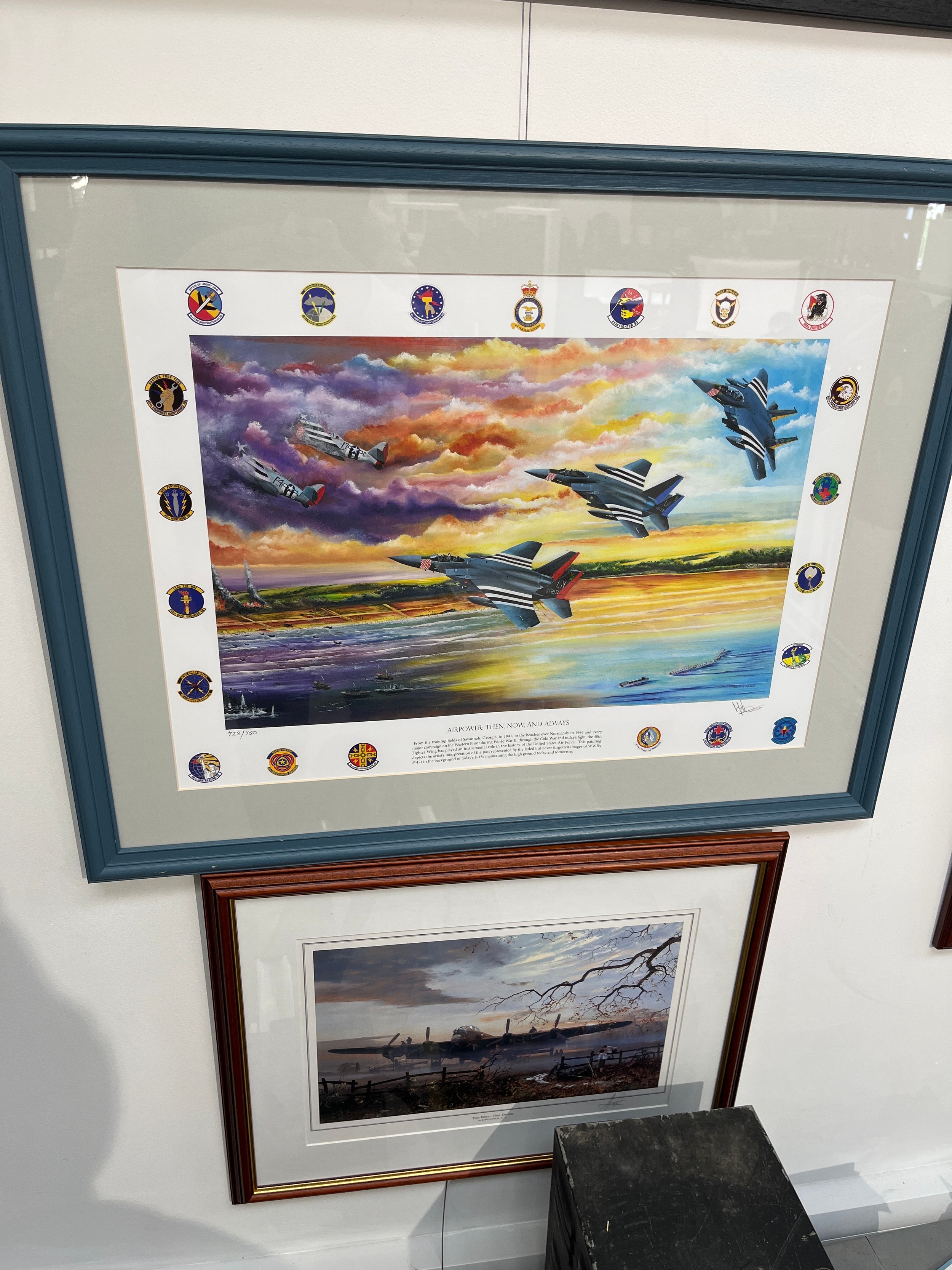A vibrant print of F15 and P47s in flight, signed, 728/750, framed and glazed, together with another