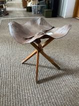 A late 19th/early 20th Century campaign leather top stool