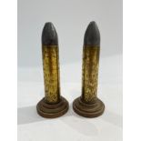 A pair of WWI trench art shell cases engraved 'HMS LAPWING 1914-15', mounted onto plinth bases