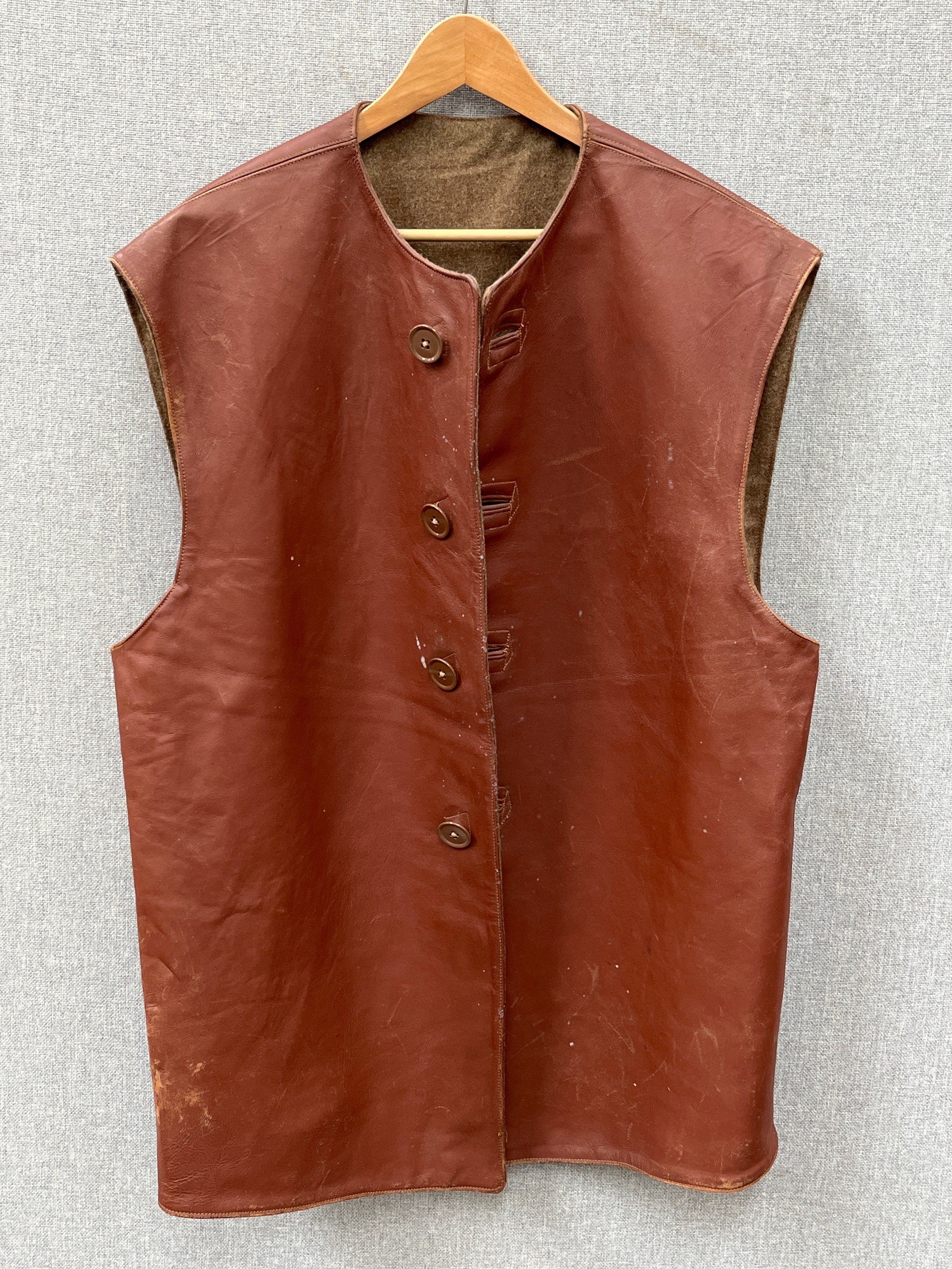 A WWII British leather jerkin, dated 1944, size no. 2