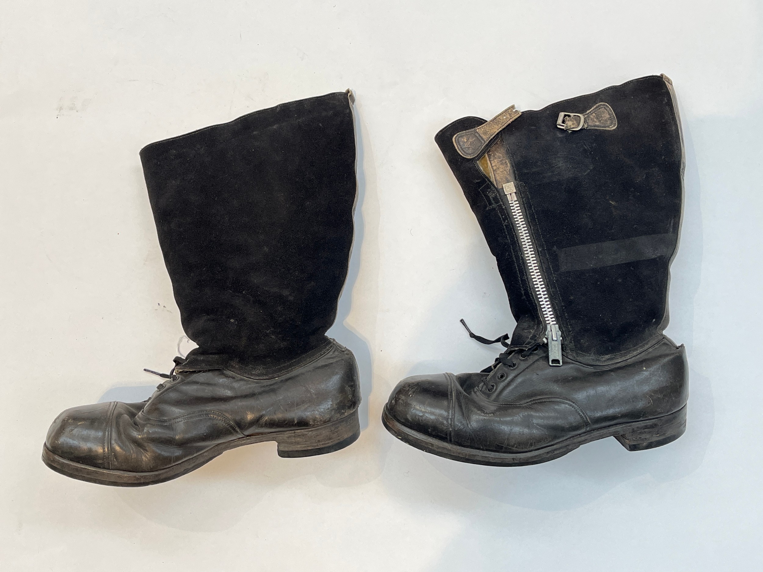 A pair of WWII British RAF flying boots “escape boots”, black leather and suede, the lower shoe