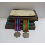 A pair of RAF medals together with three pre WWII log books, RAF pocket book etc, relating to C.G.