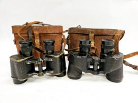 A pair of WWII RAF Air Ministry marked binoculars with brown leather case with another pair (2)
