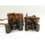 Two pairs of binoculars with leather cases