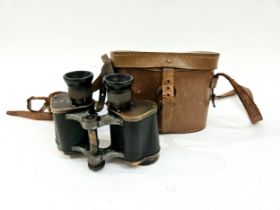 A pair of WWI era Imperial German binoculars by Zeiss, stamped with M (Marine) and crown, together