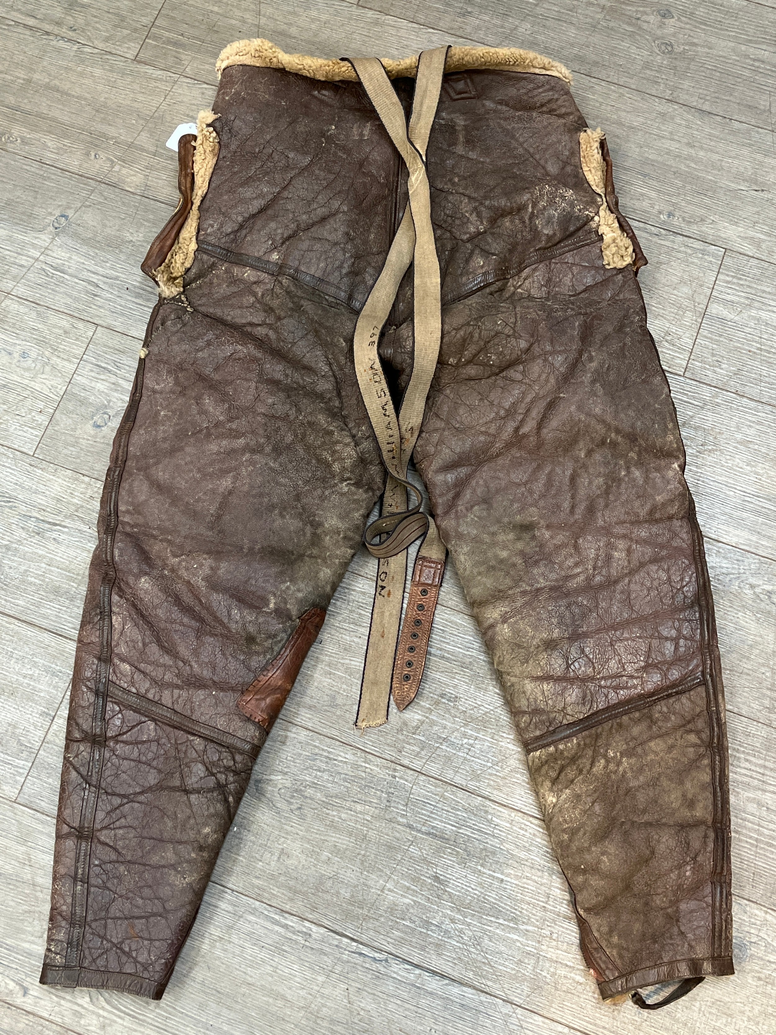 A WWII pair of Irvin sheepskin leggings, the straps marked SGT. E. WILLIAMSON - Image 2 of 2