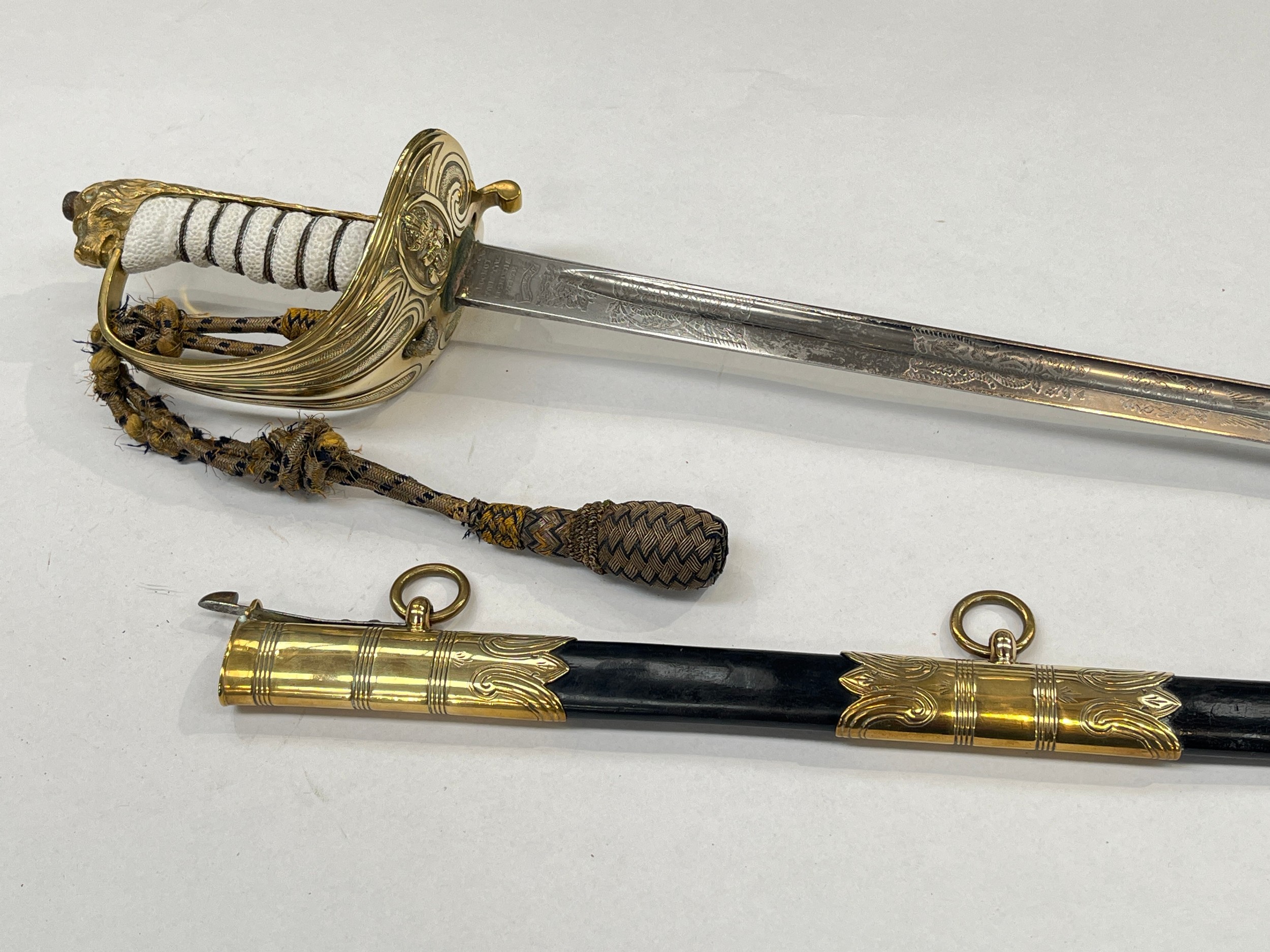 A Royal Naval officer's sword by Gieve Matthew’s / Wilkinson, painted textured grip, George crown to