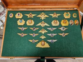 A cased collection of Russian USSR Soviet and later badges and insignia including Parachute